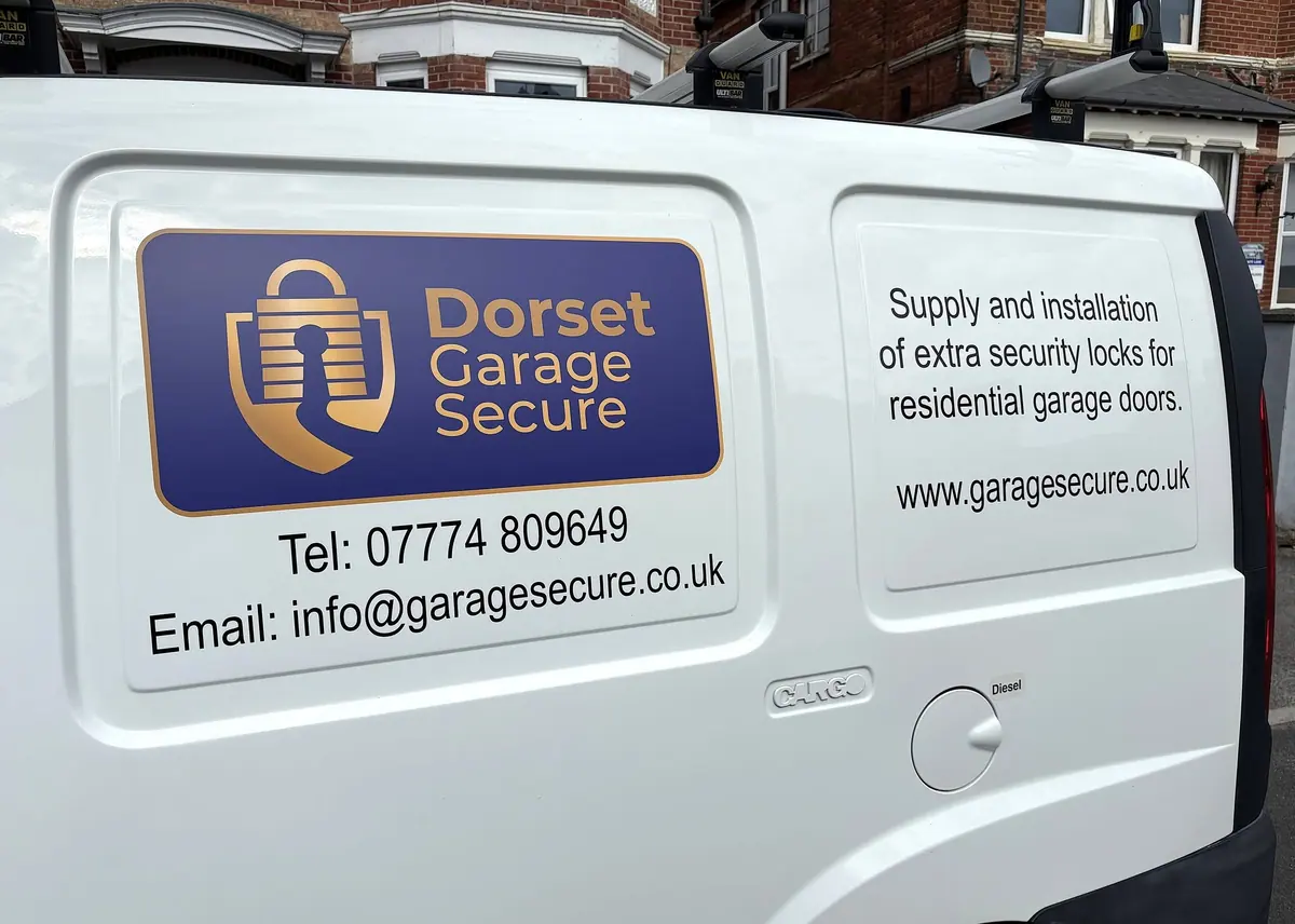 The side of Rob’s white van with the gold Dorset Garage Secure padlock logo on a violet panel, his phone number and email, and the words “Supply and installation of extra security locks for residential garage doors”